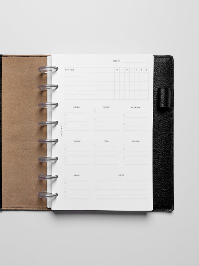 Insert in use inside a black leather planner.