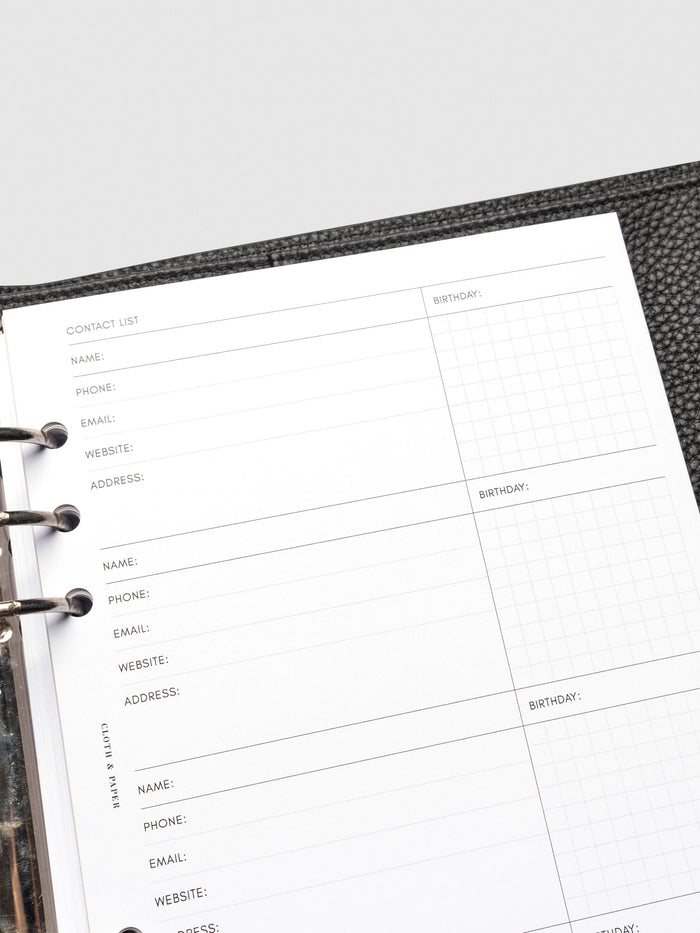 Refreshed Contact List Planner Inserts styled inside a black leather agenda.