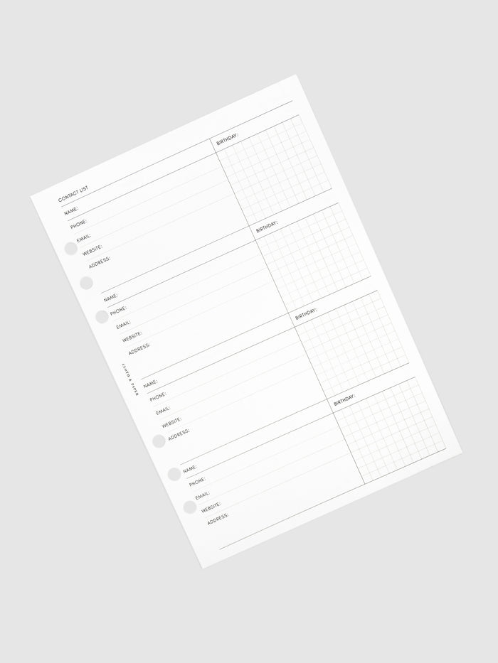 Stack of inserts turned to the left against a neutral background.