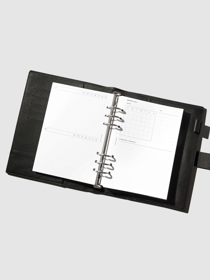 Inserts in use inside a leather planner.