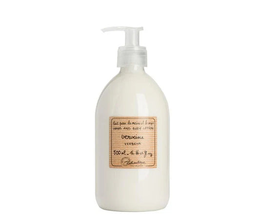 A clear plastic bottle with a pump dispenser labeled Lothantique Sandalwood Hand&Body, containing a light-colored lotion.