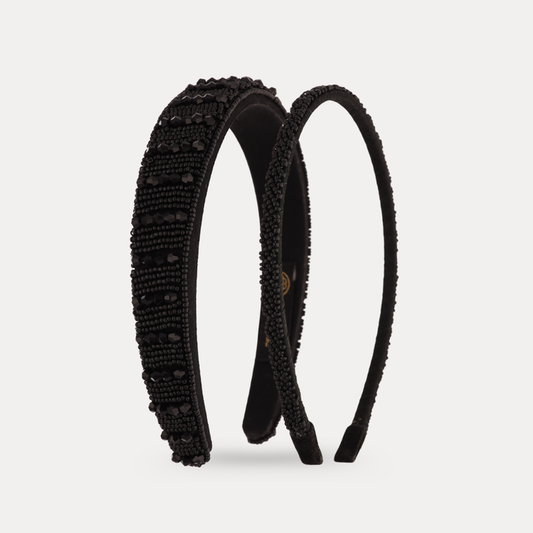 a black headband with black beaded edges