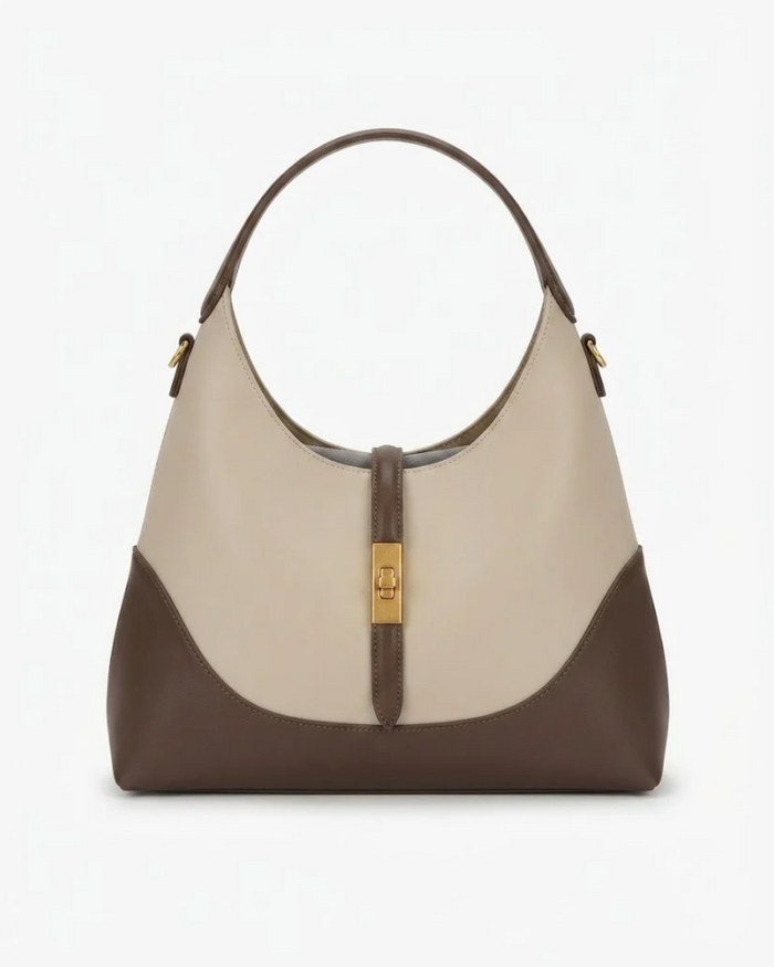 Two-tone hobo handbag in beige and dark brown with gold zipper pull and hardware