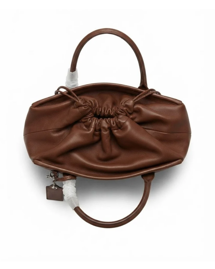 Dark brown leather-look drawstring handbag with ruched top and side zipper tassel