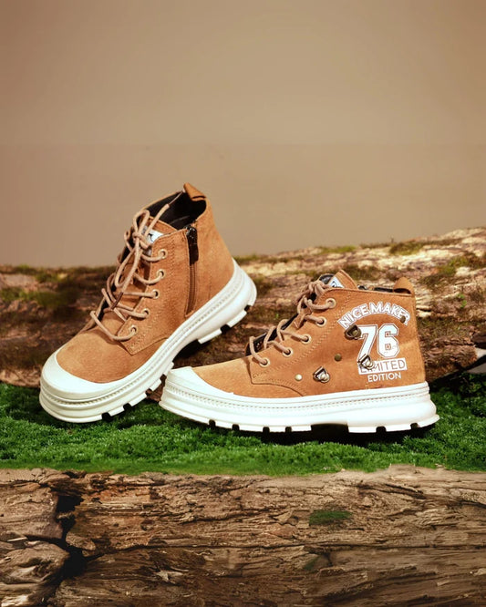 Boys rugged tan lace-up sneakers with high-top style and white rubber sole