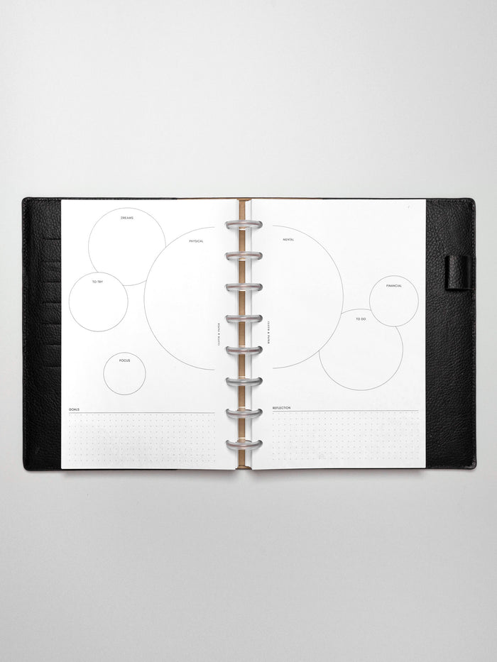 Insert in use inside a black leather planner.